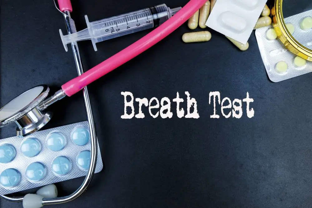 Person taking breath test for alcohol detection and roadside sobriety check.