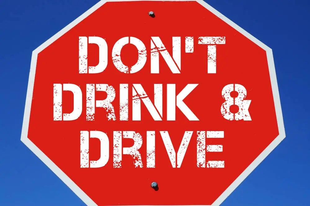 Stop sign urging people not to drink and drive for road safety awareness.