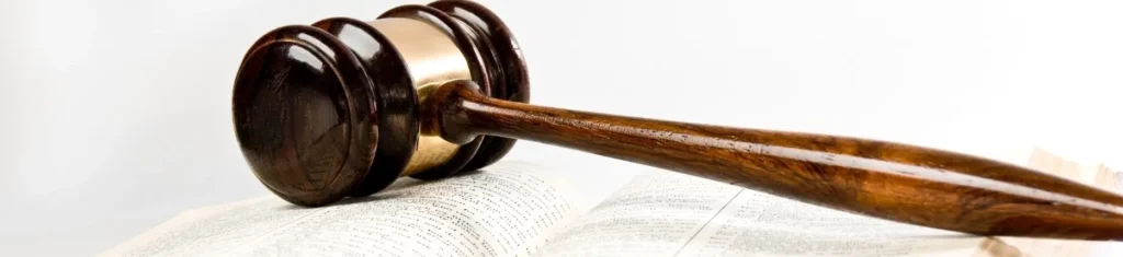 Wooden gavel resting on an open law book symbolizing summary judgment procedures in North Carolina courts.