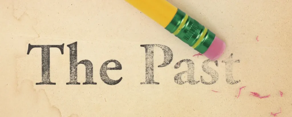 A pencil eraser partially removing the words “The Past” from paper, symbolizing the concept of expungement in NC and the ability to erase past criminal records.