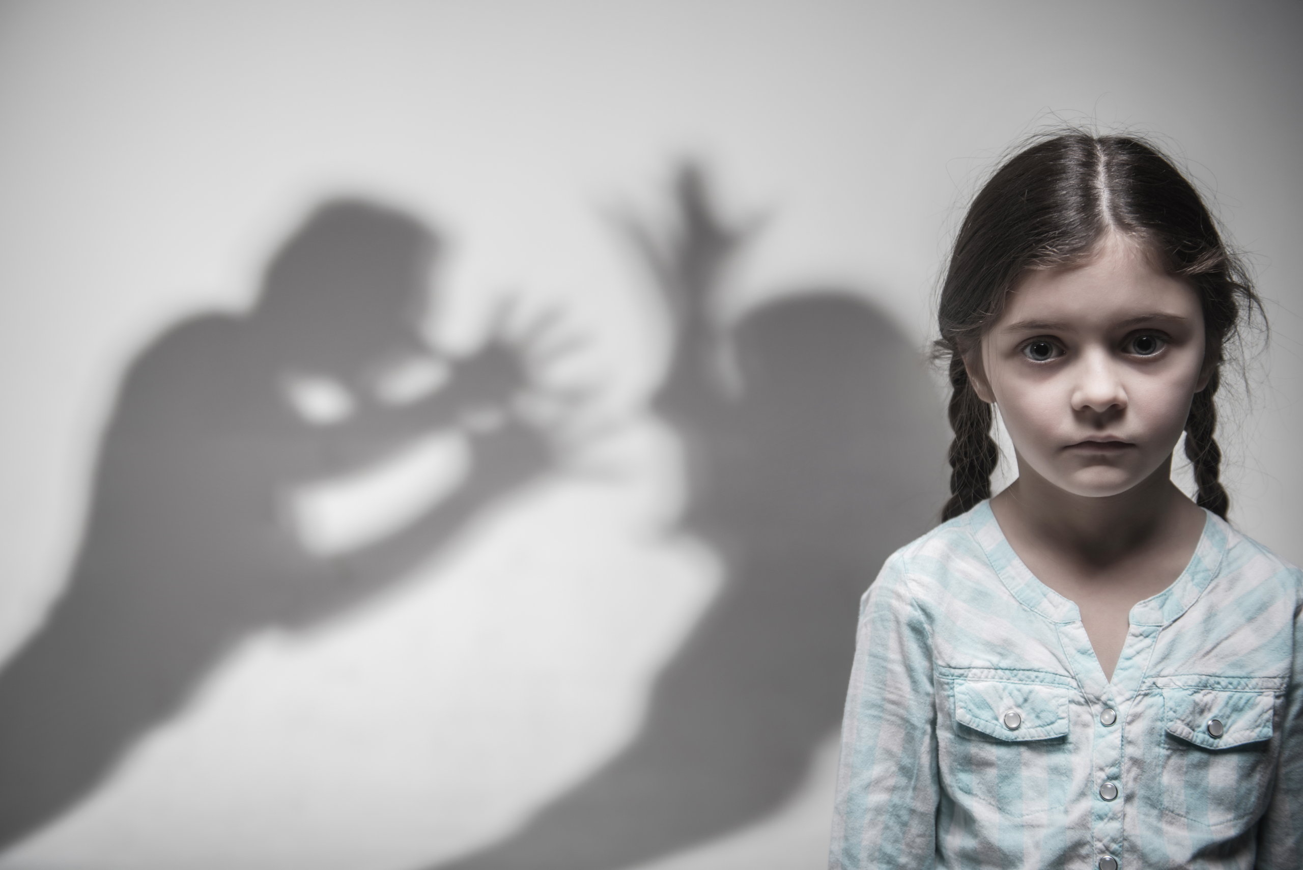 Woman seeking help for domestic violence awareness and prevention support.