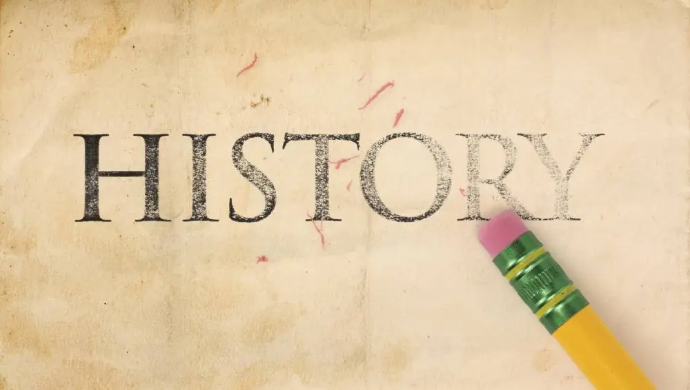 The word "HISTORY" partially erased with a pink eraser on aged paper.