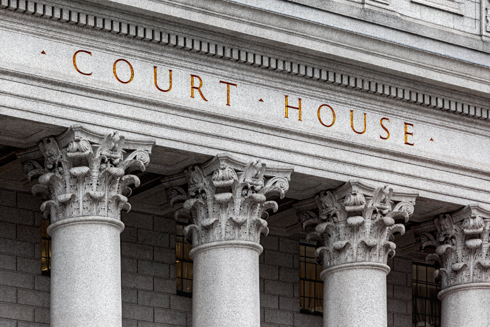 Historic courthouse building with classical architecture and grand stone columns.